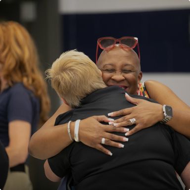 2 people hugging.